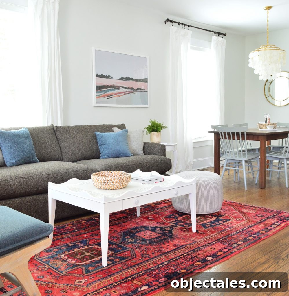 Duplex Living Room and Dining Room Transformations 2 Scallop Coffee Table on Red Rug With Crate And Barrel Sofa