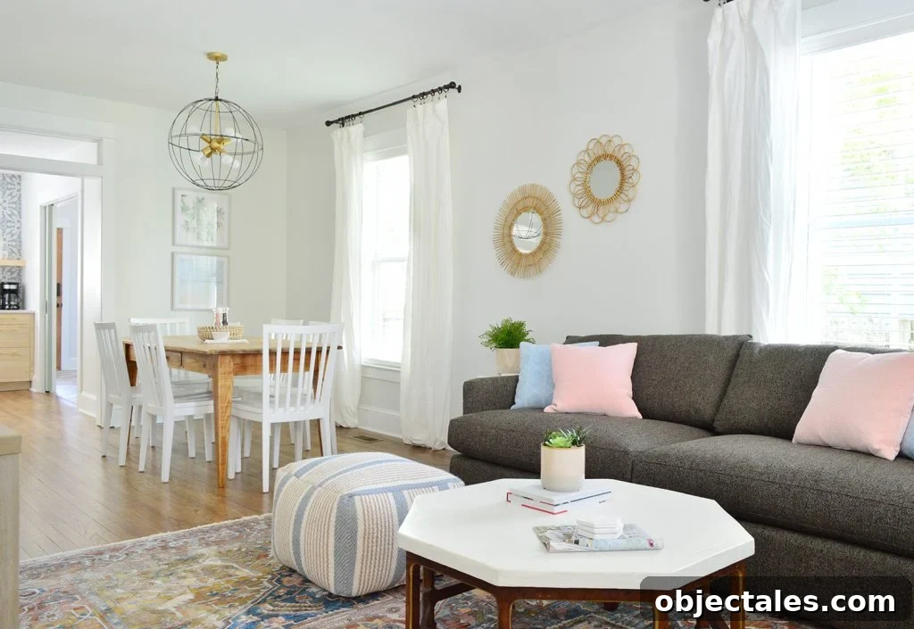 Duplex Living and Dining Room Makeovers Revealed 9 Open Living And Dining Space In Duplex With Crate And Barrel Sofa