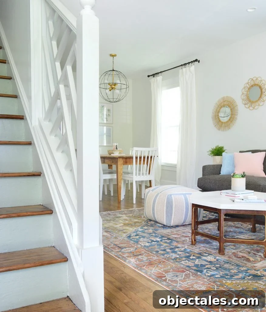 Duplex Living and Dining Room Makeovers Revealed 11 Chippendale Railing In Foreground Of Duplex With Blue Stair Risings