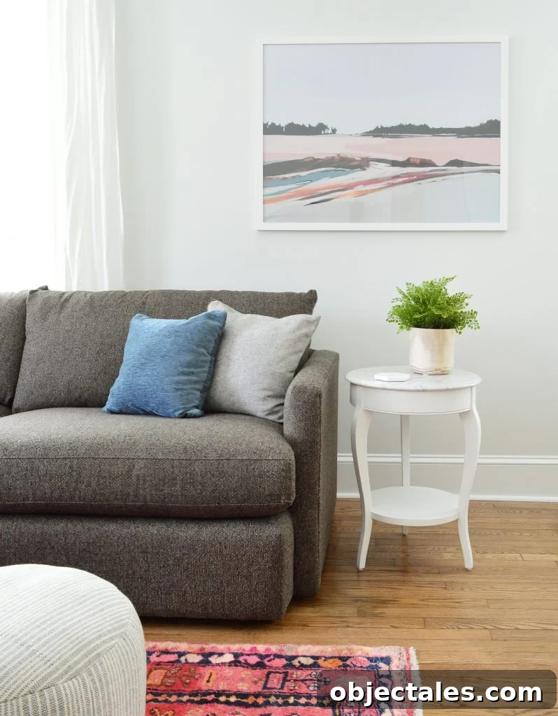 Duplex Living Room and Dining Room Transformations 4 Juniper Print Shop Art In Bright Living Room With Marble Table Crate And Barrel Sofa