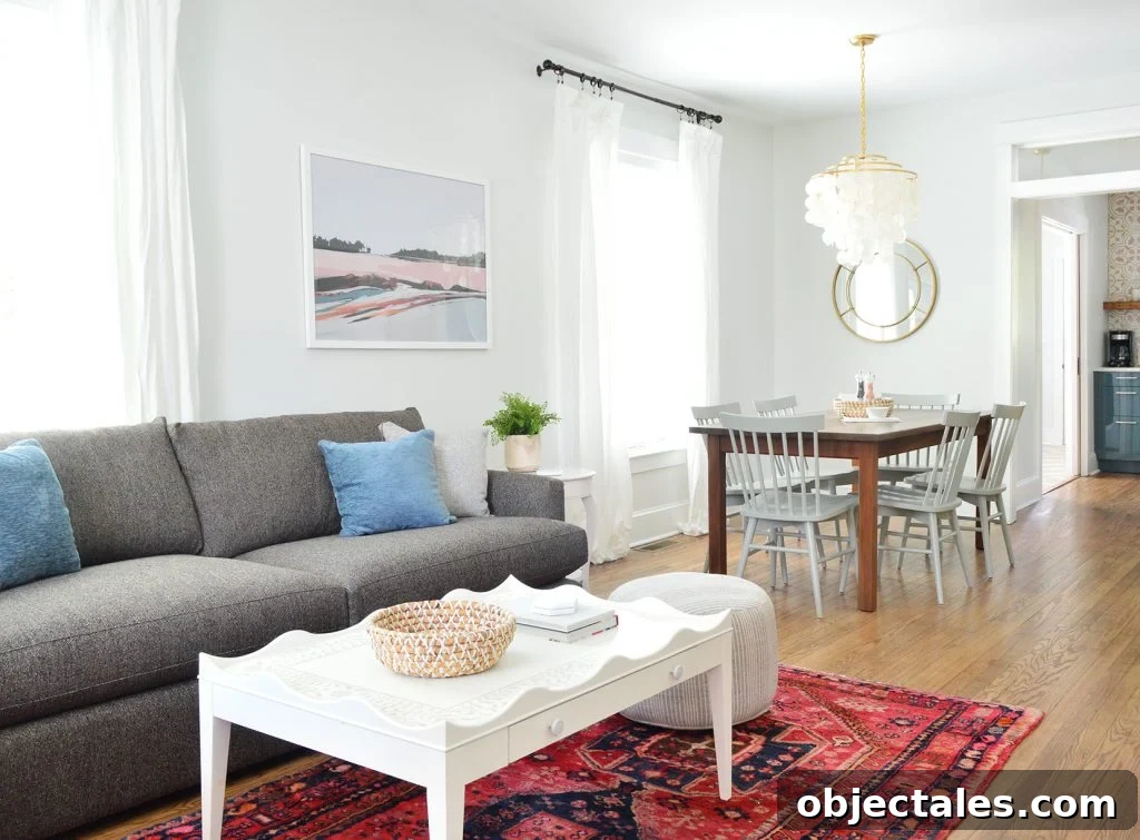 Duplex Living Room and Dining Room Transformations 9 Open Living Dining And Kitchen With Crate And Barrel Sofa And Scallop Coffee Table