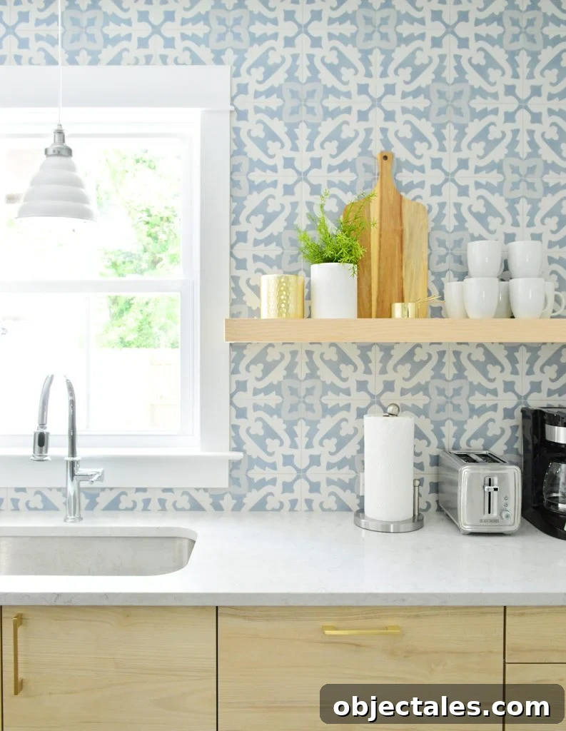 Wood Colored Opened Shelf Against Blue Tile Backsplash