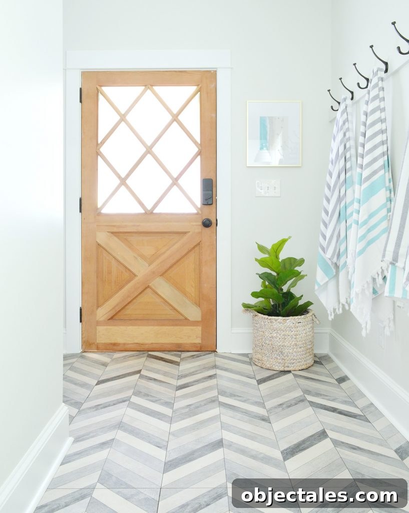 Diamond Paned Wood Door In Duplex Mudroom With Chevron Floor
