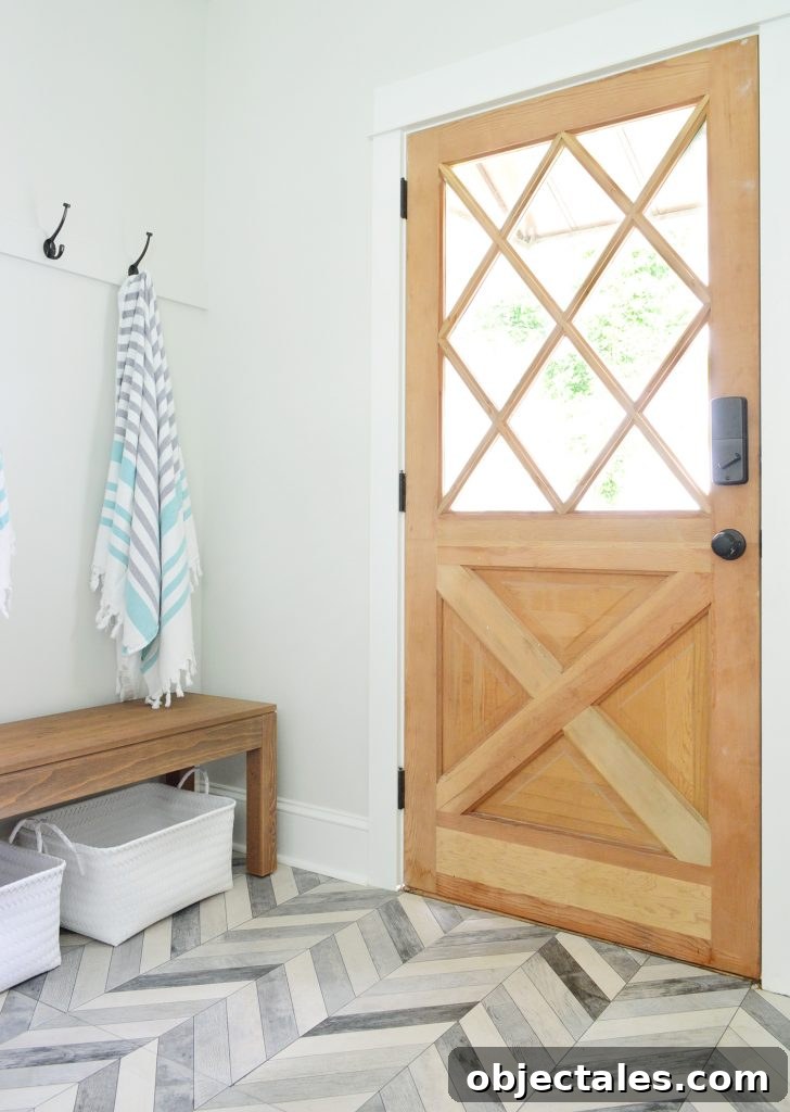 Diamond Paned Wood Door With Bench And Hooks In Duplex Mudroom