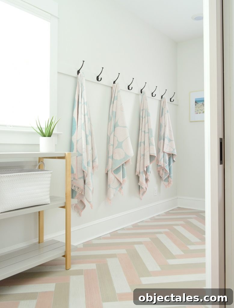 Hanging Towel Hook Storage In Duplex Mudroom With Herringbone Tile Floors