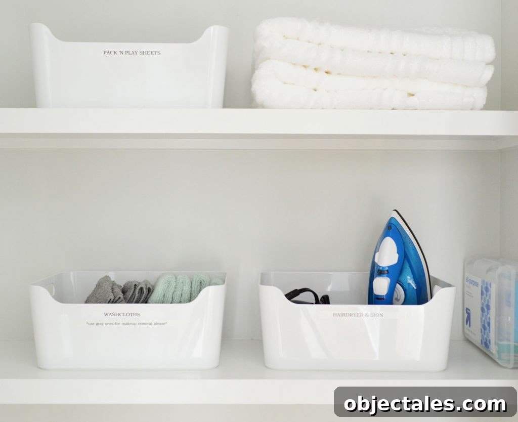 Labeled White Bins in Duplex Linen Closet
