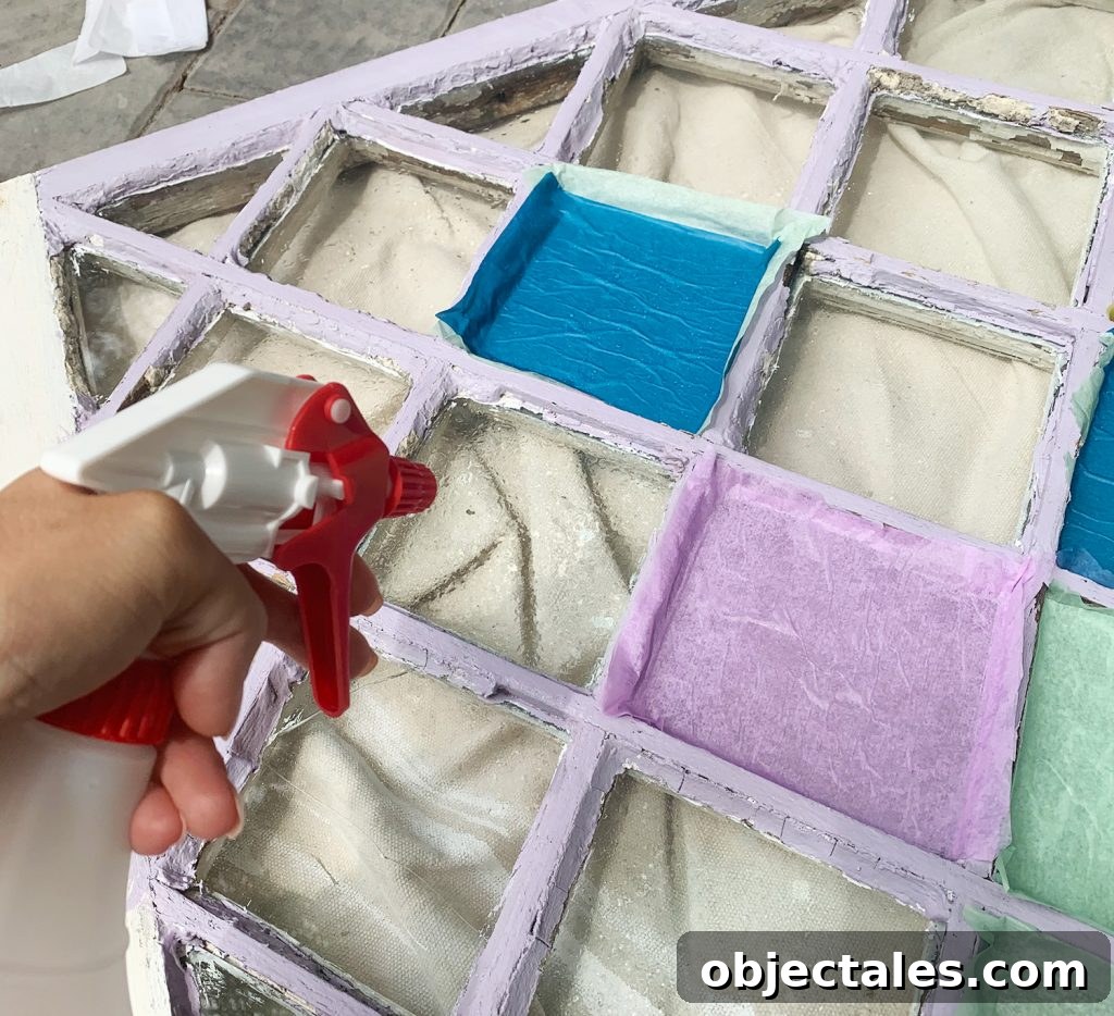 Spraying Diamond Window Pane With Water From Spray Bottle