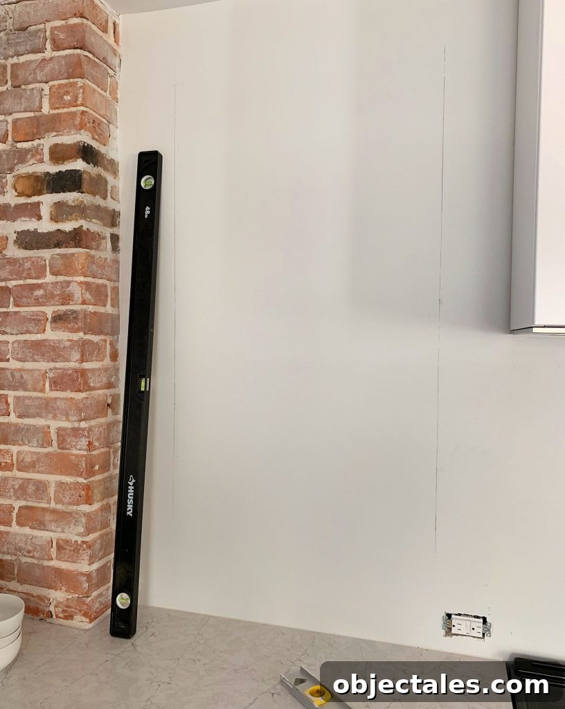 Shiplap Wall Plank Makeover for Just 31 Dollars 12 Long Level Used To Mark Vertical Lines On Wall
