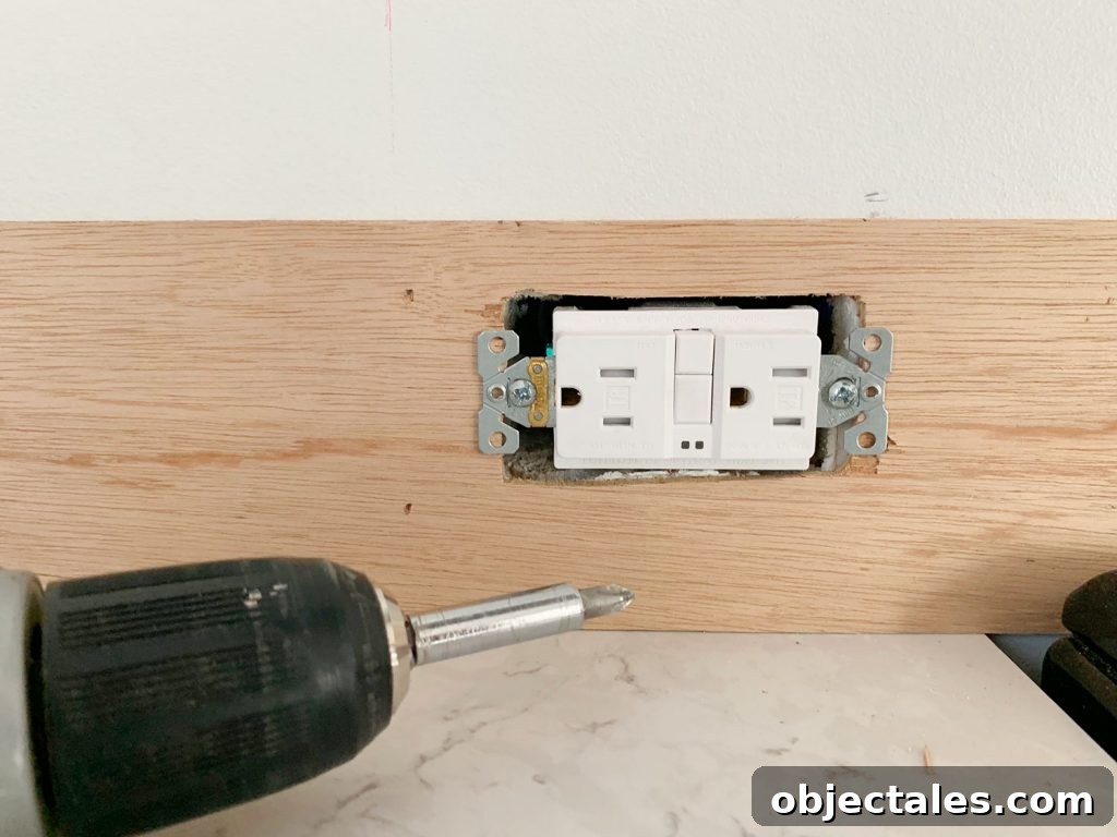 Shiplap Wall Plank Makeover for Just 31 Dollars 13 Electrical Outlet Screwed Back In Place Over Panel Strip