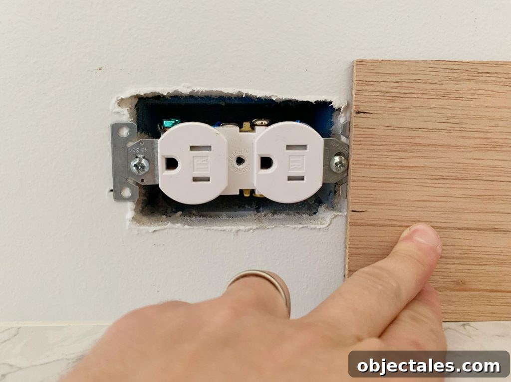 Shiplap Wall Plank Makeover for Just 31 Dollars 15 Height Of Electrical Outlet Marked Using Scrap Wood Panel