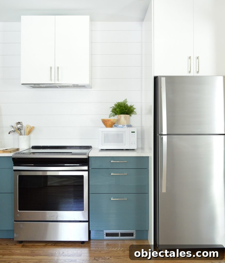 White Planked Wall Shiplap With Blue Ikea Cabinets