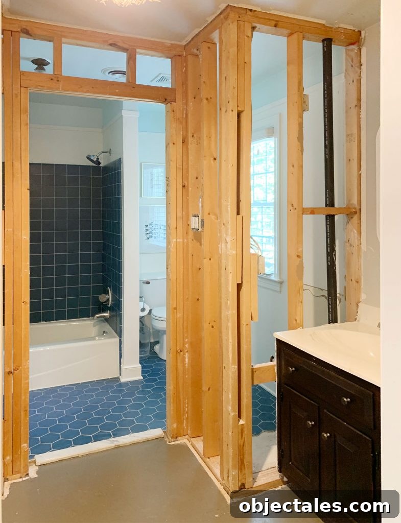 How to Start a Bathroom Renovation: Planning and Budget Tips 4 Bathroom mid-renovation with walls opened up