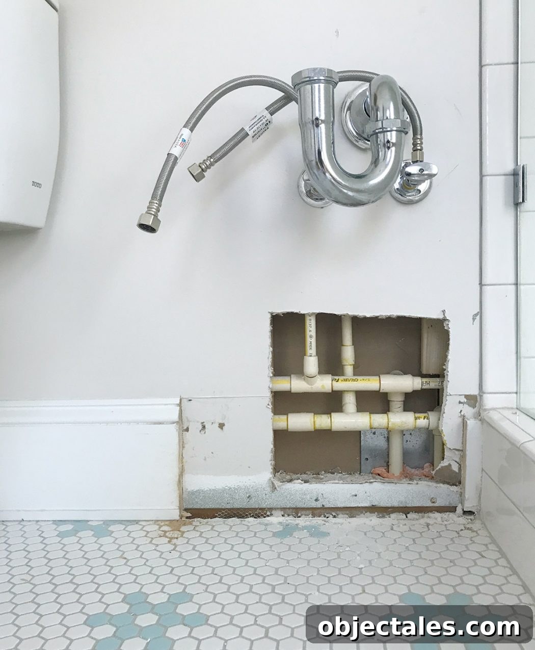 Bathroom leak exposed in wall