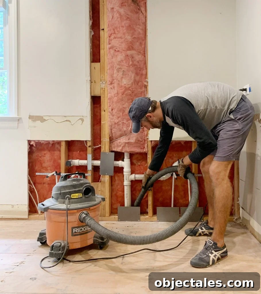 Episode 152: The Haunted Room at Our Beach House 4 Wet/dry vac in use during bathroom demo