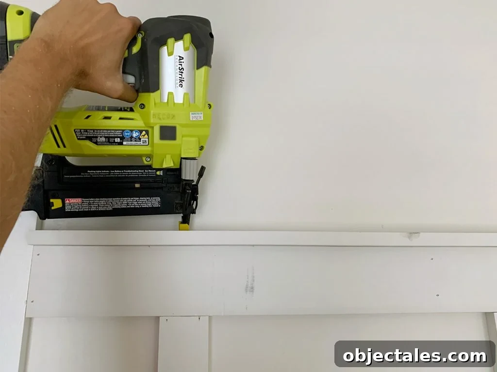 Nail Gun Attaching Top Rail Lip Across Board And Batten