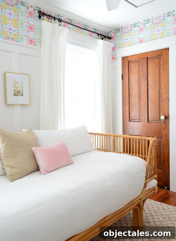 Rattan Daybed With White Bedding In Room With Wood Doors