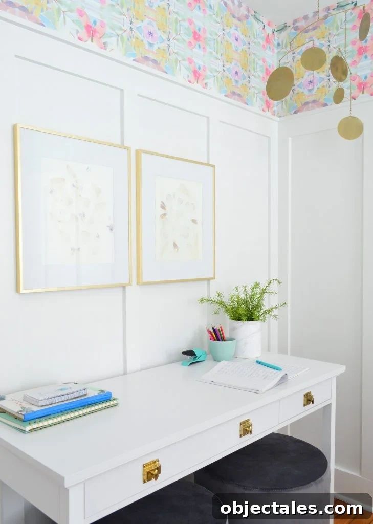 Coastal Bedroom with Wallpaper and Board-and-Batten 6 White Desk With Gold Hardware Against Board And Batten With Brass Frames And Mobile