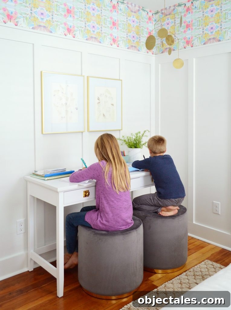 Coastal Bedroom with Wallpaper and Board-and-Batten 8 Kids Sitting On Stools As Writing Desk In Beachy Bedroom