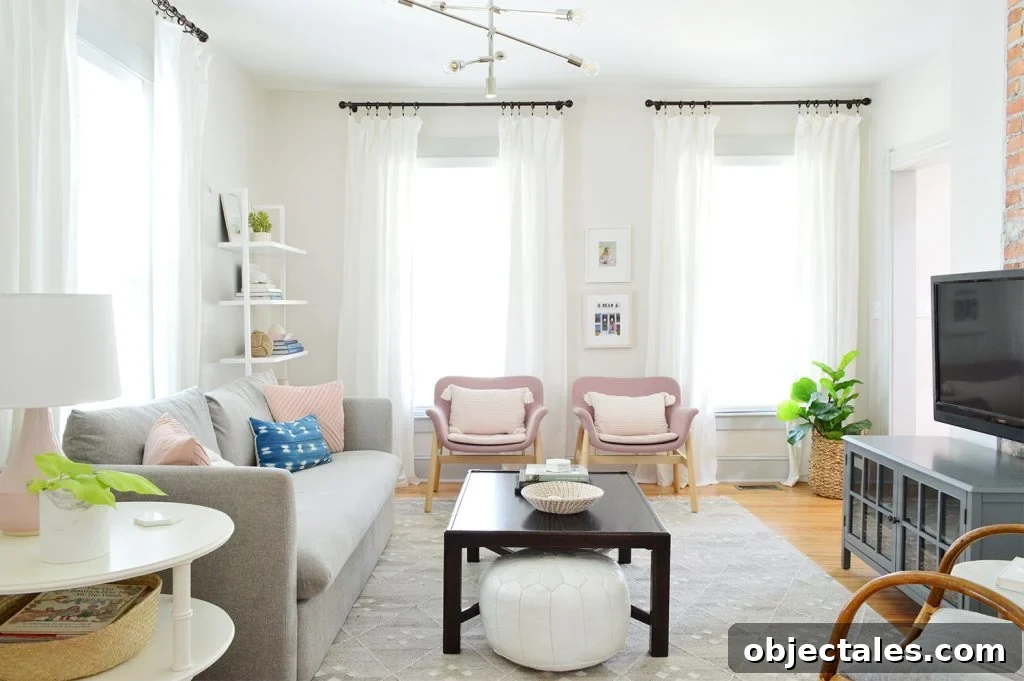 7 Beach House Updates: What We Changed and Why 9 Beach House Living Room Pink Chairs With Dark Coffee Table