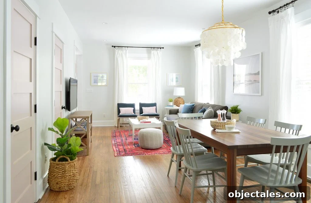 Open Living And Dining Room In Bright Beach House With Pink Doors