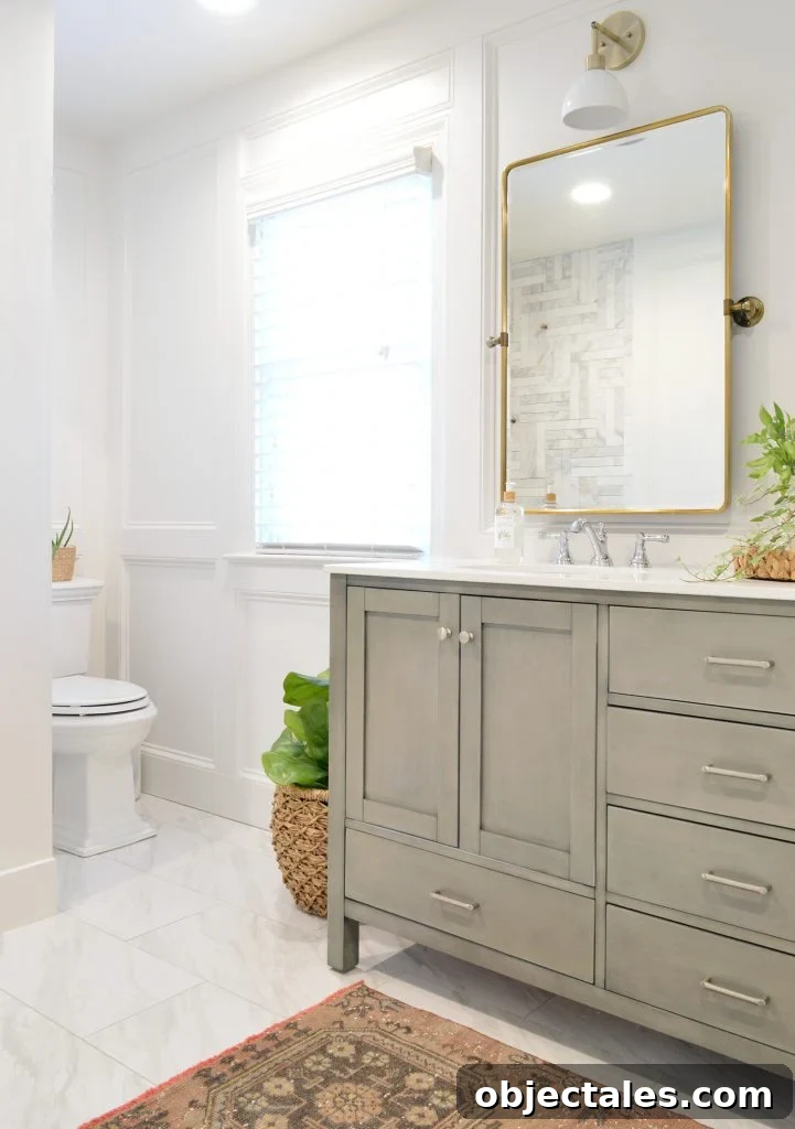 Bathroom and Closet Remodel Reveal 3 Master Bathroom Update With Gray Vanity Installed With Brass Mirror