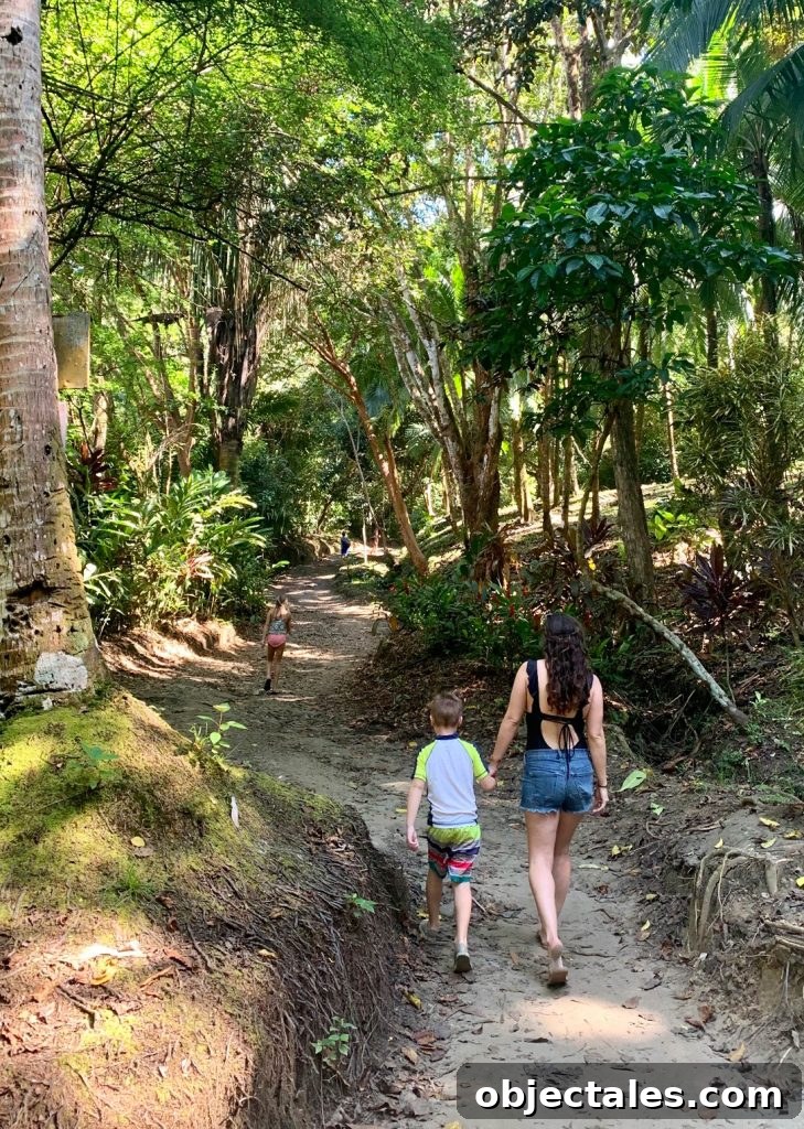 Costa Rica Family Travel: Top Activities and Tips 14 Mom Walking With Young Kids To Secret Playa Biesanz Beach In Costa Rica