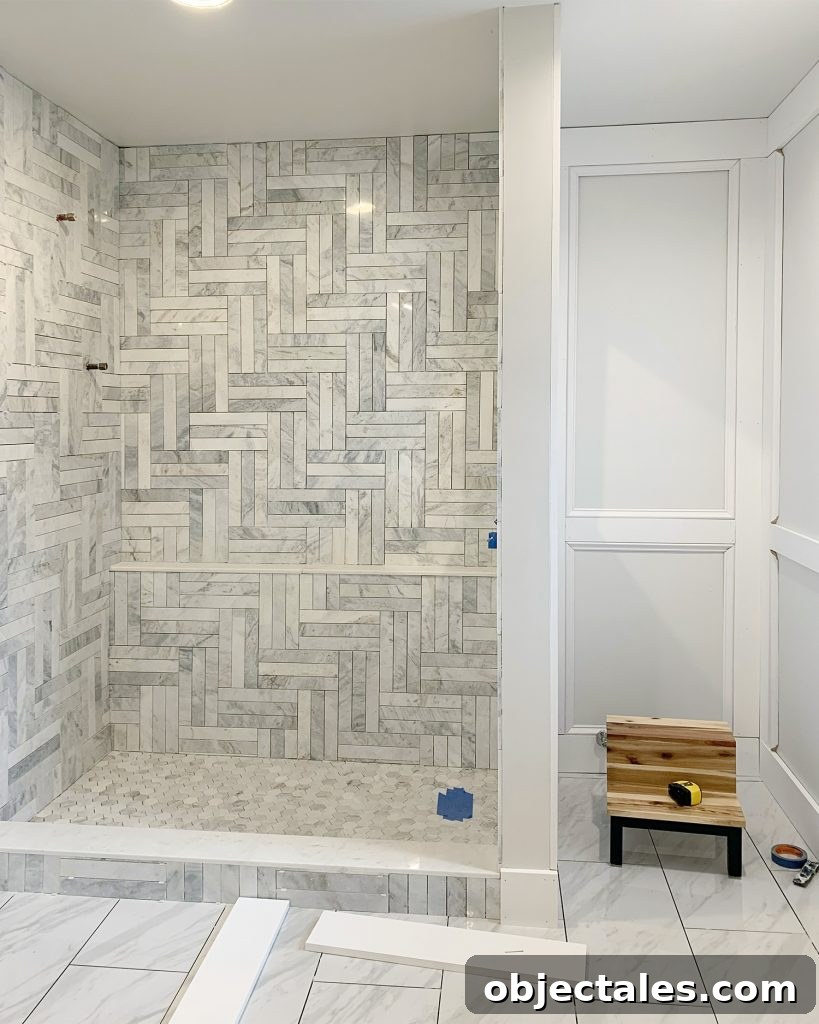 Unpainted Decorative Wall Molding In Master Bathroom With Tiled Marble Shower