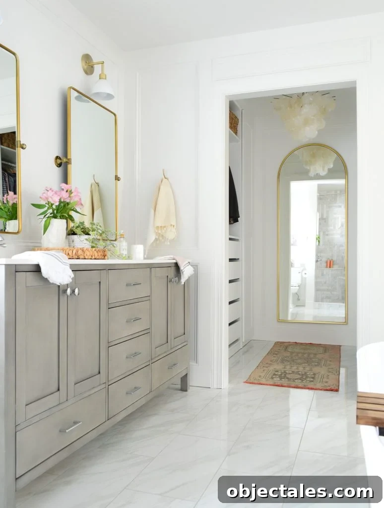 Bathroom Makeover Before and After Photos and Total Cost 11 Double Gray Bathroom Vanity Next To Entrance To Large Walk-In Closet With Arch Mirror