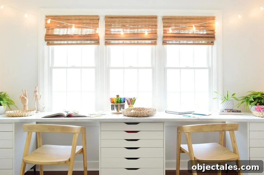 Straight View Of Kids Oversized Art Desk With Faux Marble Desktop In Front Of Window With String Lights
