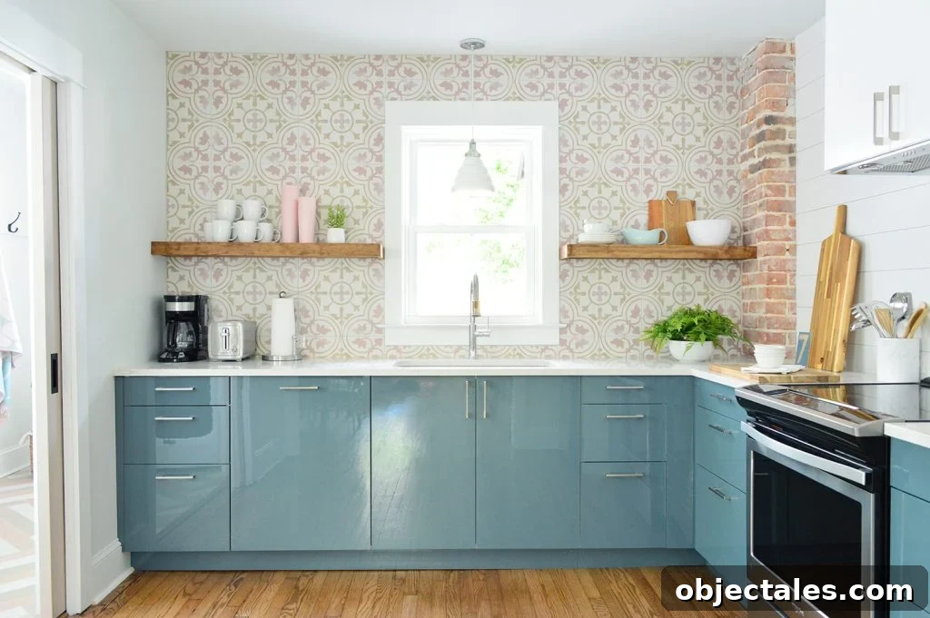 Duplex kitchen with blue cabinets and patterned backsplash