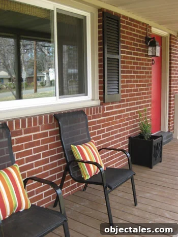 front-porch-decorating-seating-area-doorway-planter-red-door