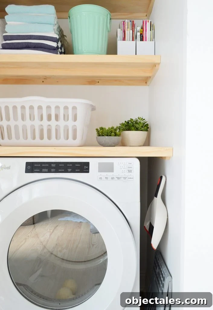 Profile view of laundry closet with DIY wood floating shelves 
