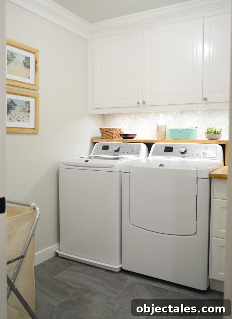 Tiled laundry room with wood butcher block DIY shelf over washer and dryer