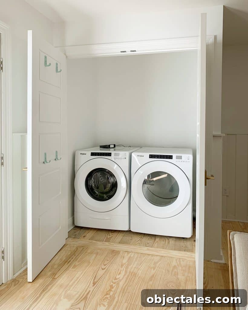 Empty laundry closet with front loading washer and dryer
