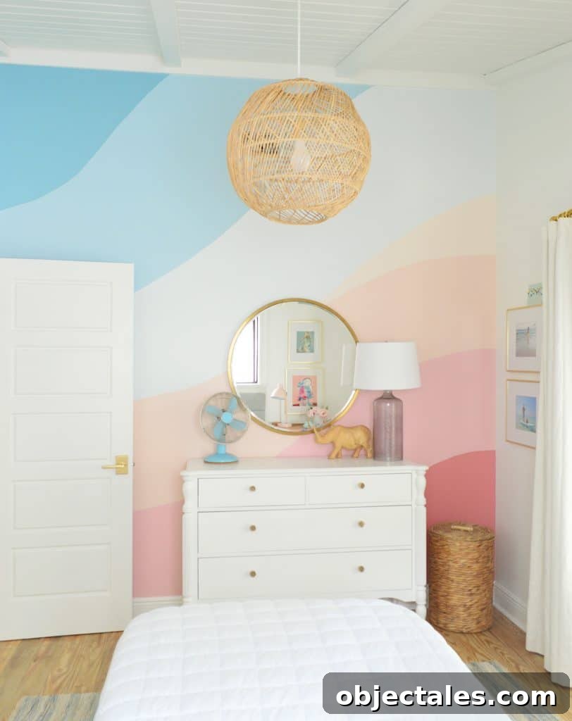 Abstract painted mural in girls bedroom with pink and blue gradient stripes