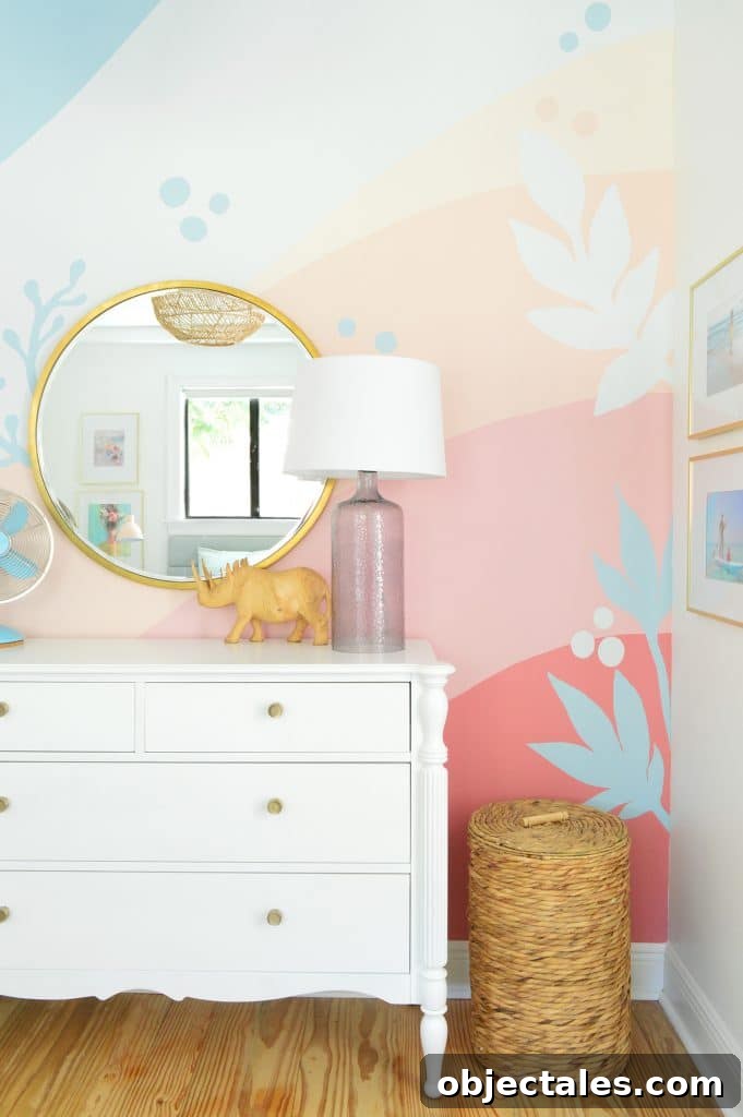 Girls room with large abstract mural with pink blue coral stripes