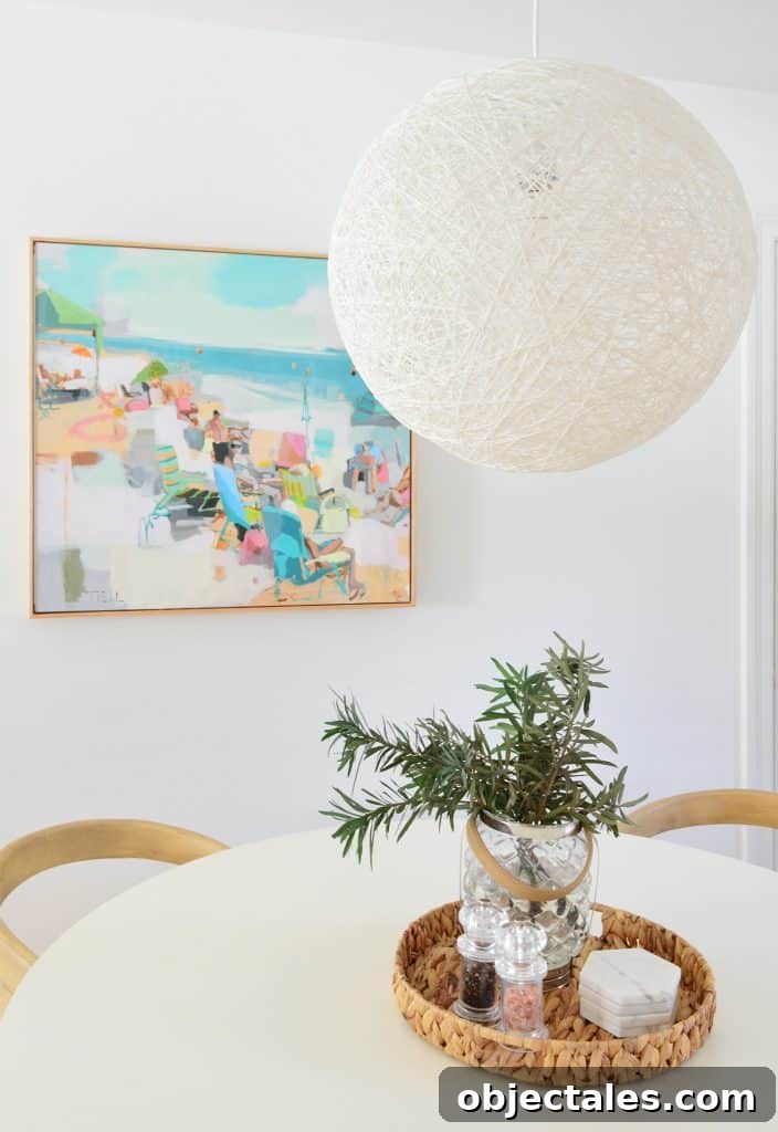 5 Quick Kitchen Upgrades That Transform Your Space 16 Large String Globe Pendant Light Over White Table With Beachy Art In Background