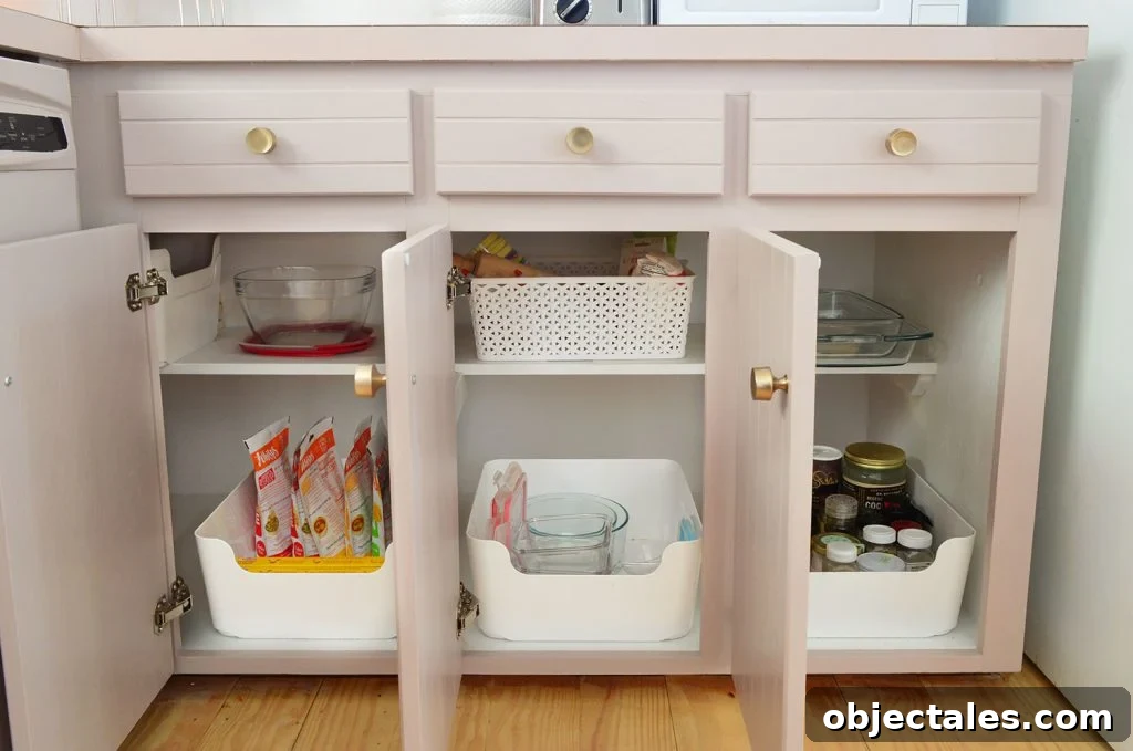 Before and After: Pink Kitchen Cabinets Makeover 15 After photo of three lower cabinets painted mauve | Sherwin Williams Artsy Pink