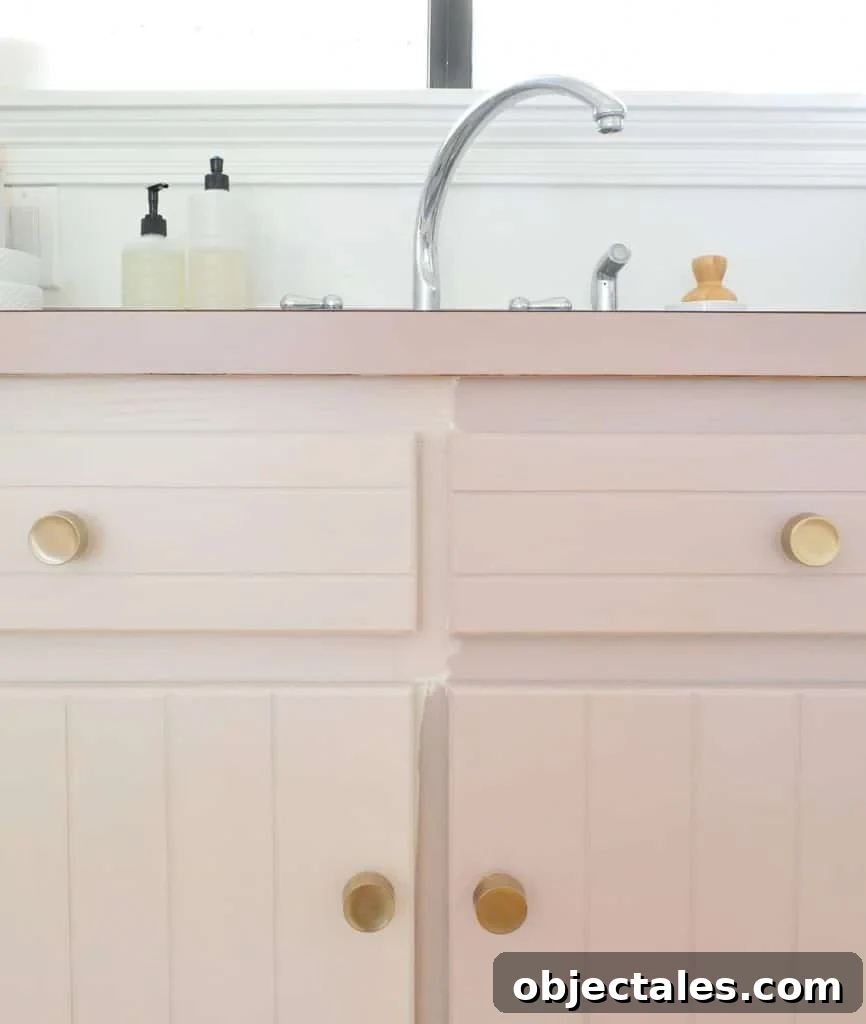 How to Paint Kitchen Cabinets Pink: Tips and Color Ideas 3 Testing two mauve paint colors side by side on kitchen cabinets