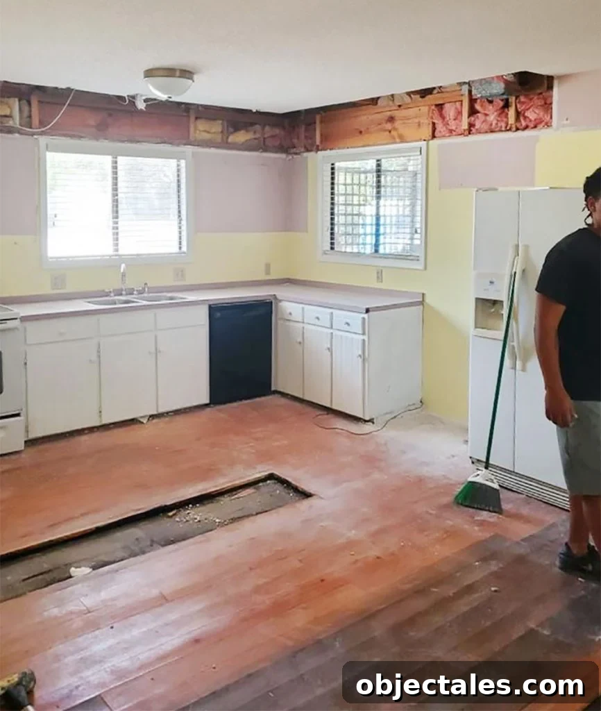 Before and After: Pink Kitchen Cabinets Makeover 8 Photo of kitchen renovation mid demolition with mauve wall paint behind cabinets