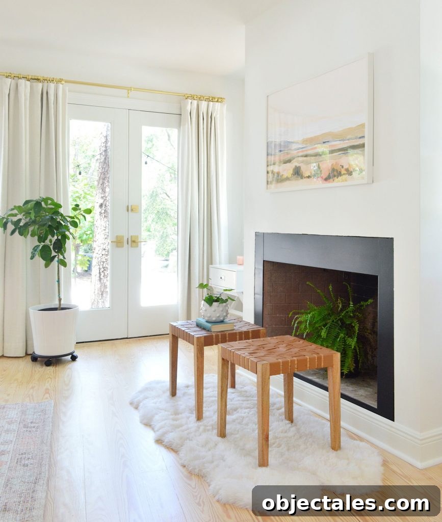 Bedroom fireplace with black border and fern in firebox