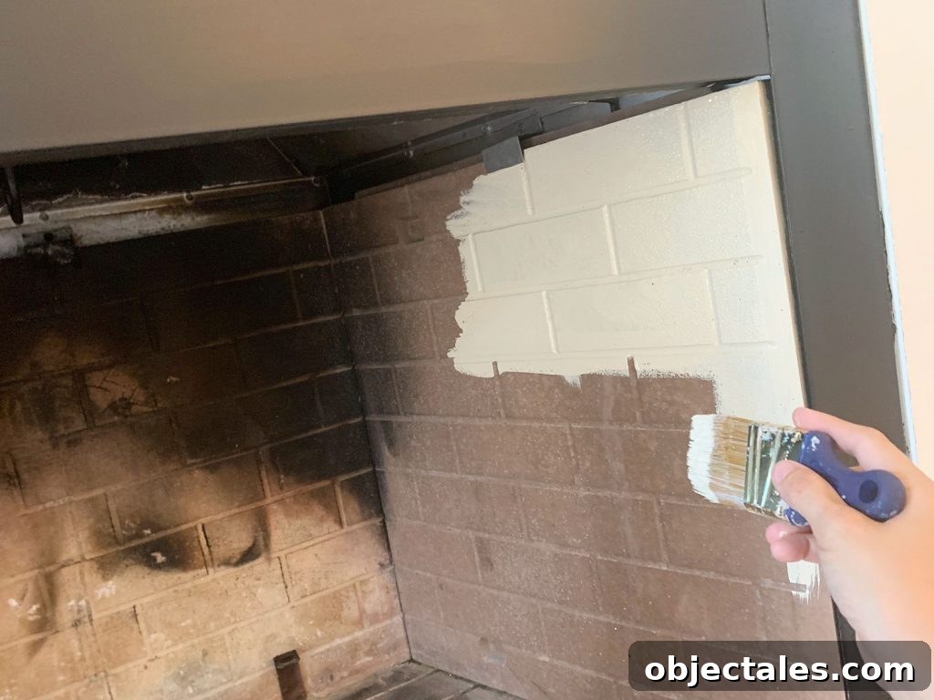Hand painting faux brick fireplace box with cream paint