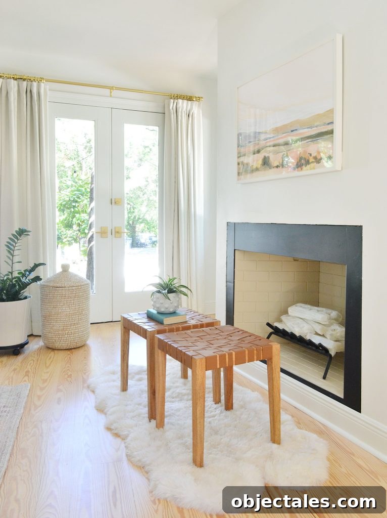 Bedroom fireplace with white crystal logs stacked like firewood and candles unlit