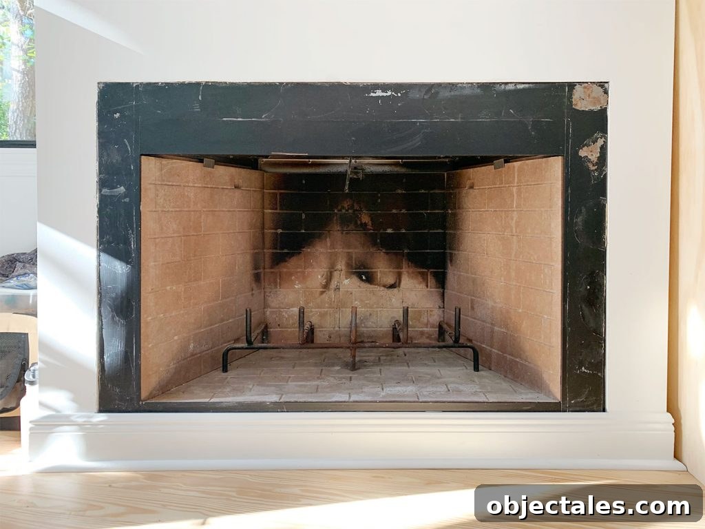 Fireplace surrounded scraped clean of old glue