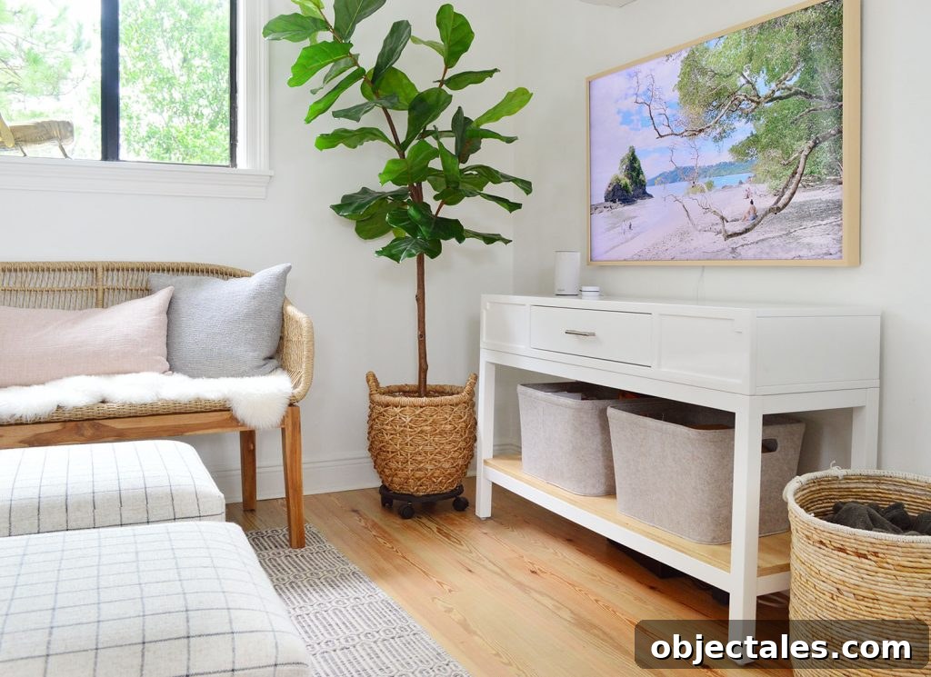 White Media Console With Frame TV And Woven Accessories