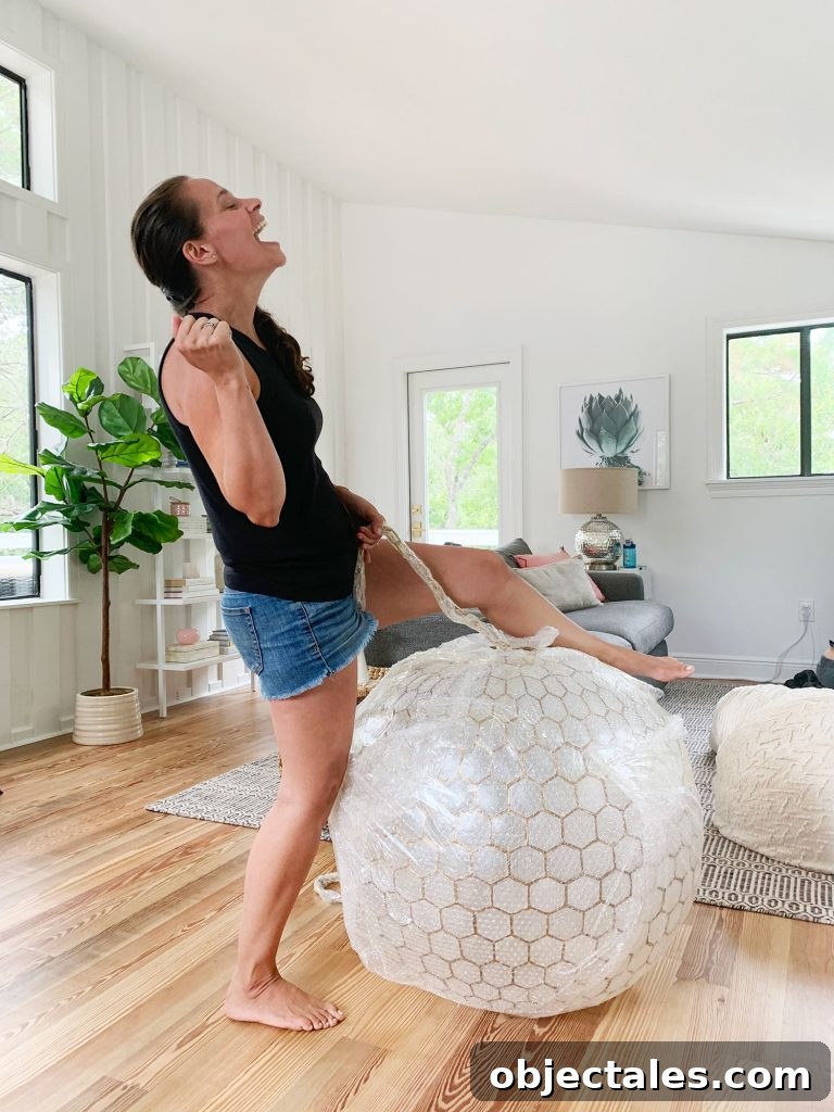 Sherry Pretending To Reenact Miley Cyrus Wrecking Ball On Large Capiz Globe Light