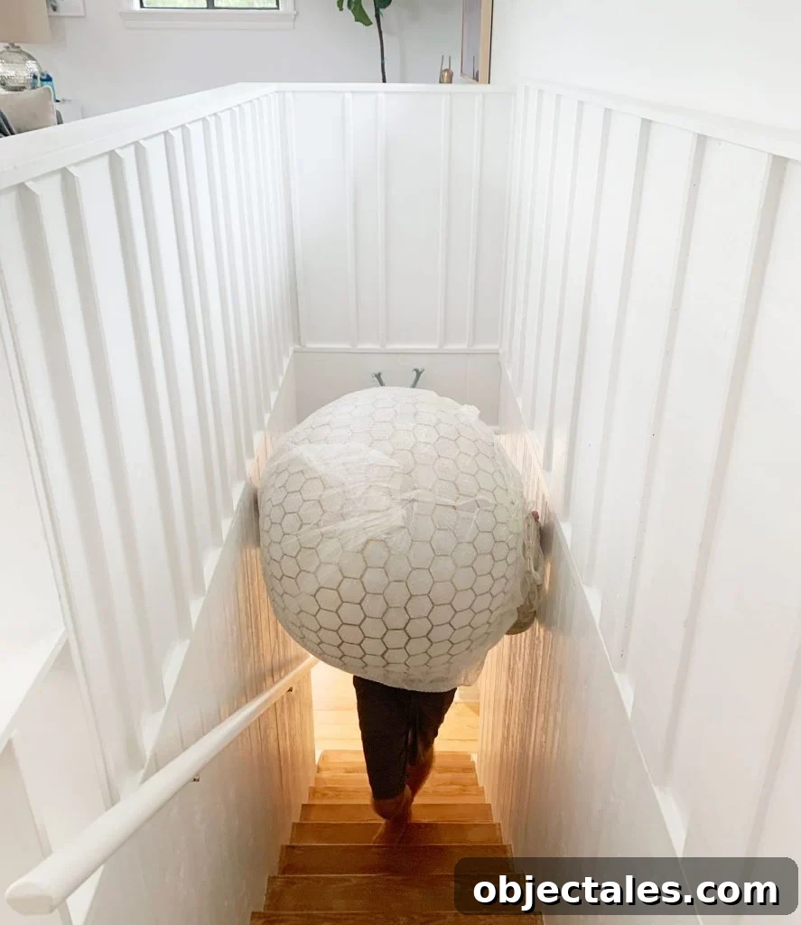 Oversized Capiz Globe Light Narrowly Fitting Up Stairs