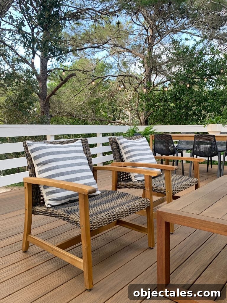 Low-Maintenance Outdoor Furniture Ideas to Refresh Your Deck 7 Two Woven And Wood Outdoor Lounge Chairs With Large Striped Pillows