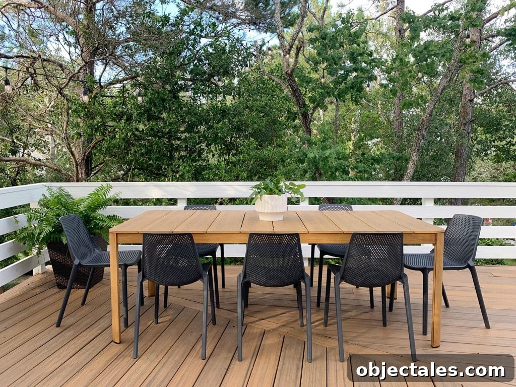 Low-Maintenance Outdoor Furniture Ideas to Refresh Your Deck 8 Metal Outdoor Dining Table With Eight Black Plastic Chairs