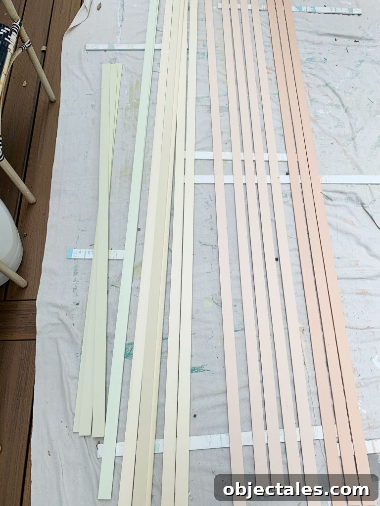How to Create a Colorful Wood Accent Wall 14 Orange Yellow And Green Painted Lattice Pieces Laid Out To Dry